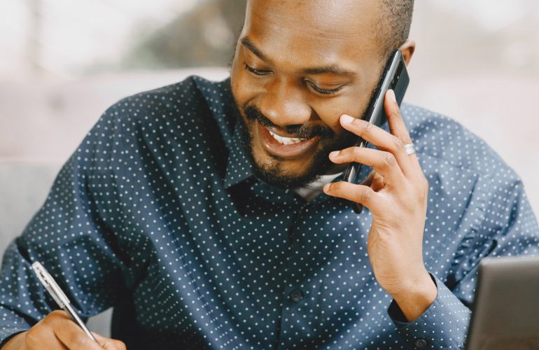 Guy on phone smiling