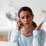 woman on phone frustrated